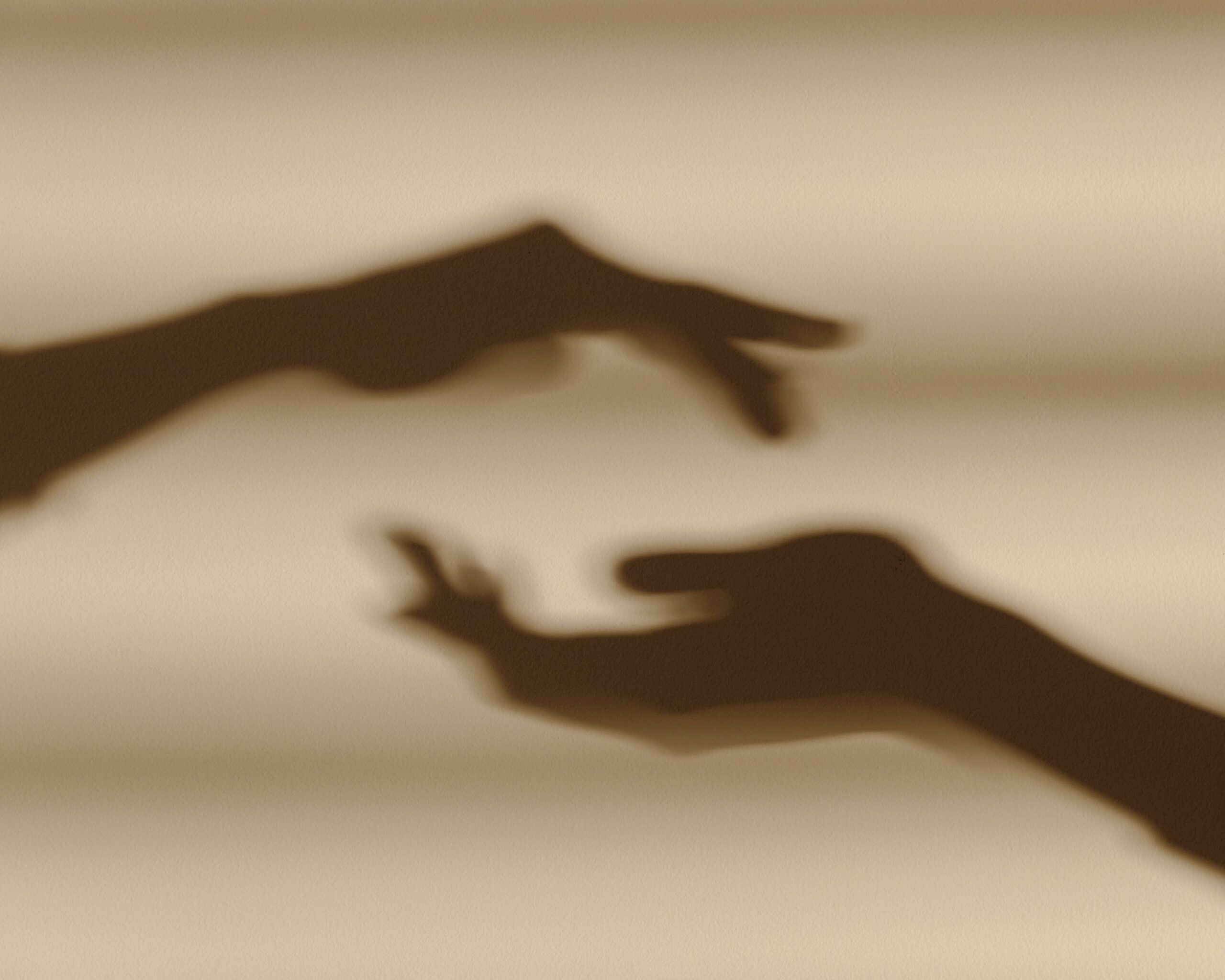 shadows-hands-white-wall